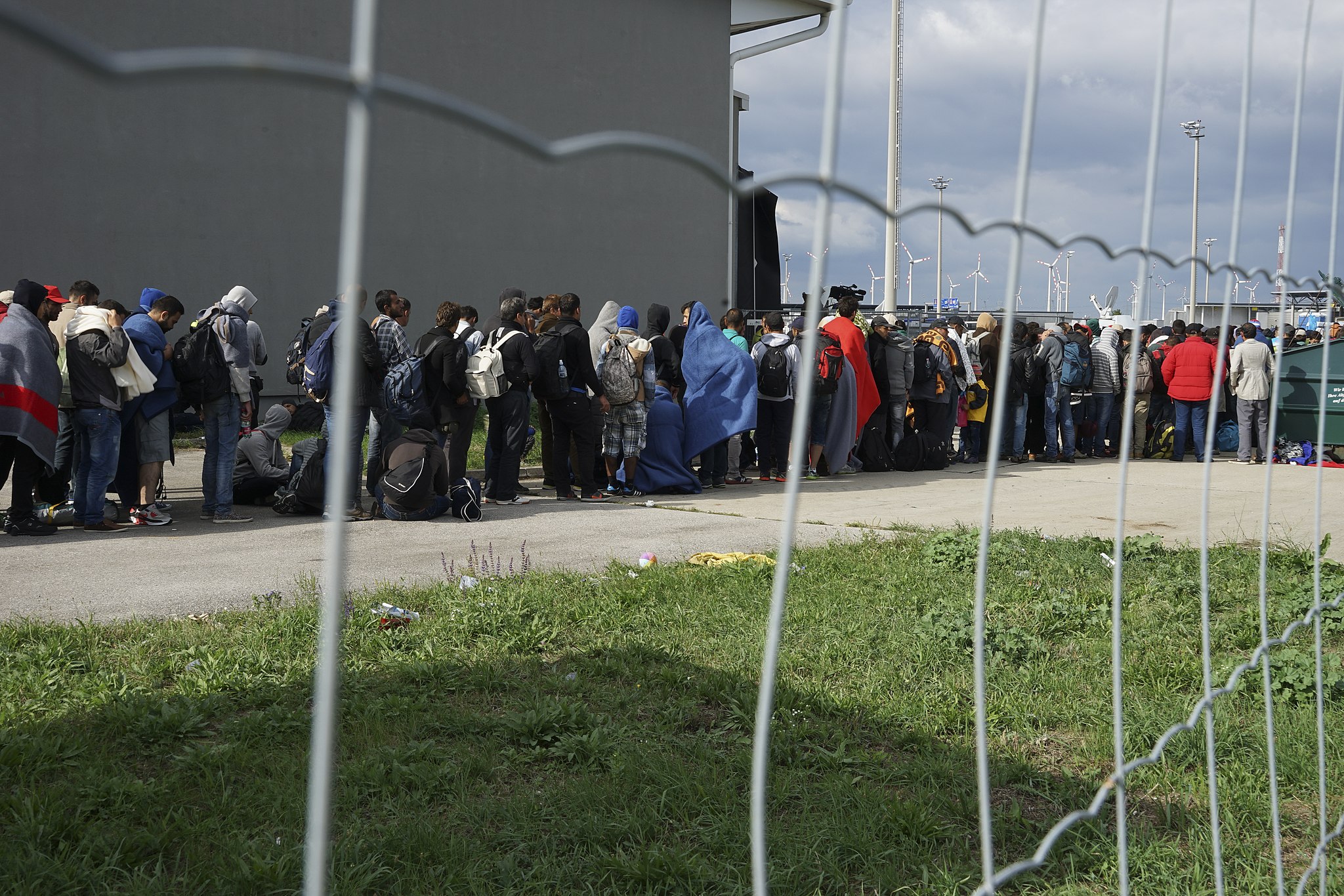A_line_of_Syrian_refugees_crossing_the_border_of_Hungary_and_Austria_on_their_way_to_Germany._Hungary_Central_Europe_6_September_2015